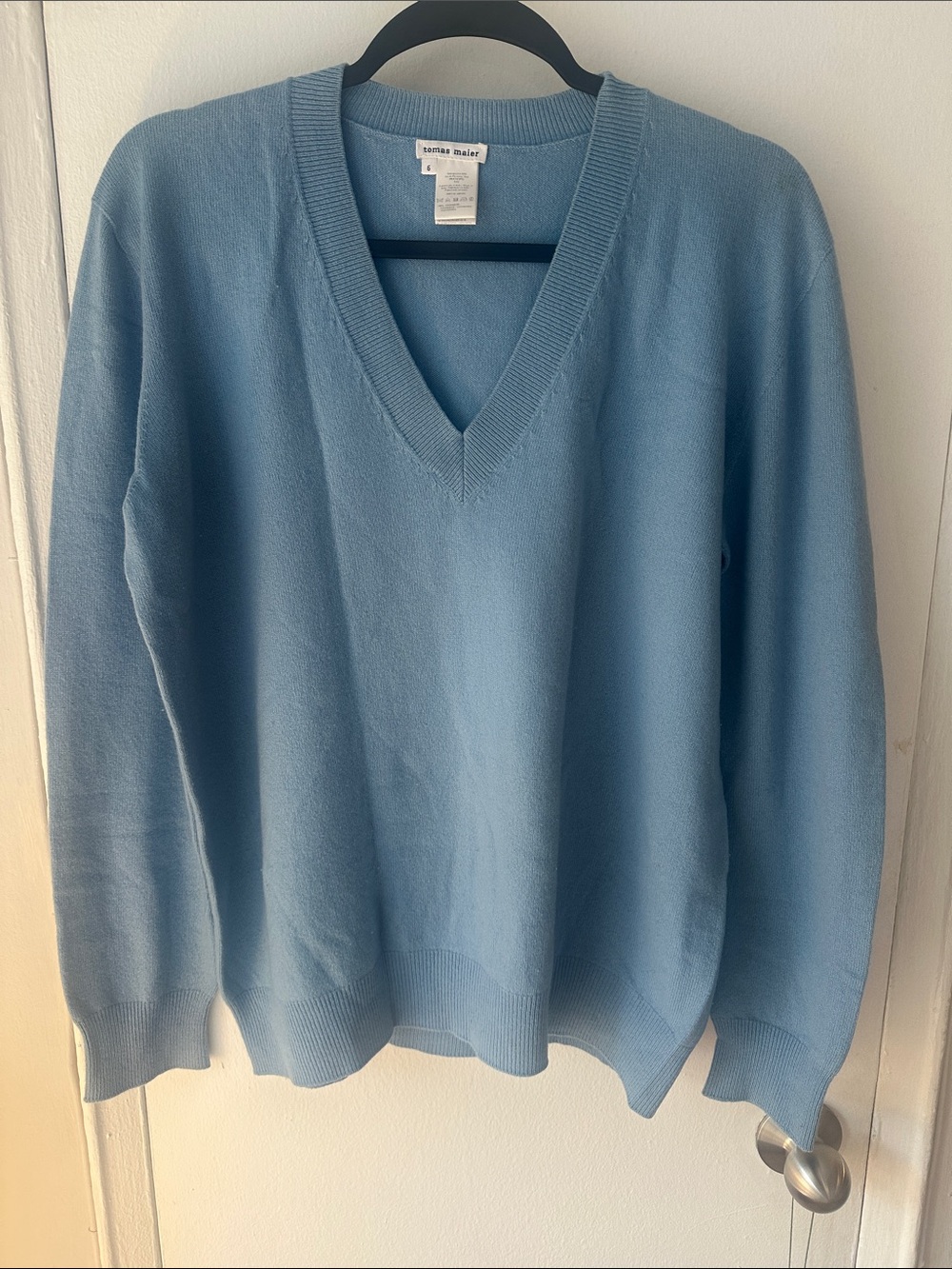 Tomas Meier’s Light Blue V-Neck Cashmere Sweater